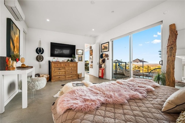 bedroom with a wall mounted AC, concrete flooring, and access to outside