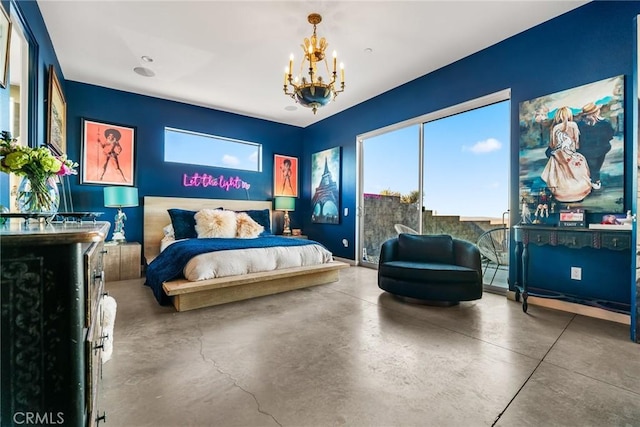 bedroom featuring an inviting chandelier and concrete flooring