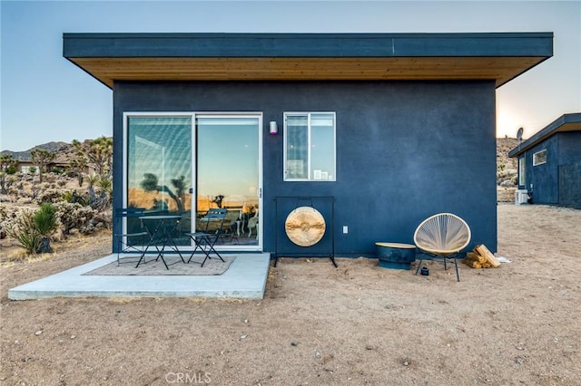 back of house with a patio