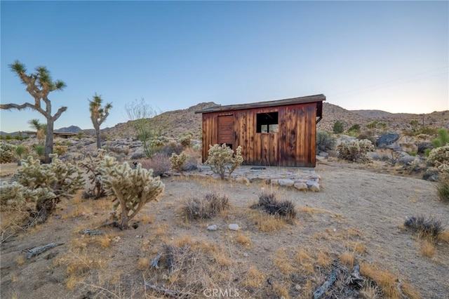 view of outdoor structure featuring a mountain view