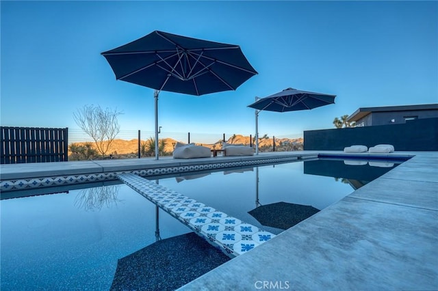 view of pool featuring a patio and area for grilling