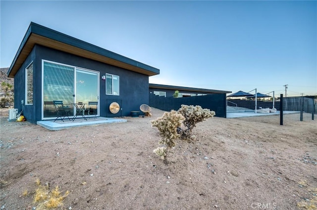 view of side of property featuring a patio