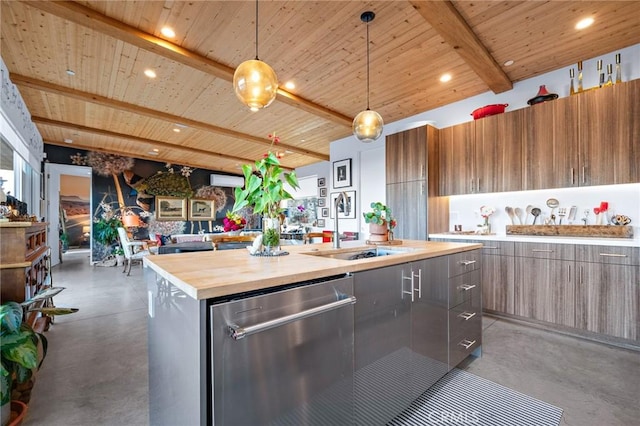 kitchen with dishwasher, decorative light fixtures, butcher block counters, beamed ceiling, and an island with sink