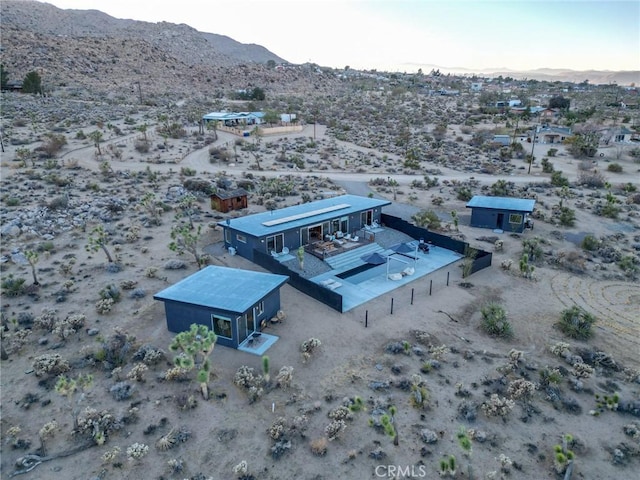 drone / aerial view featuring a mountain view