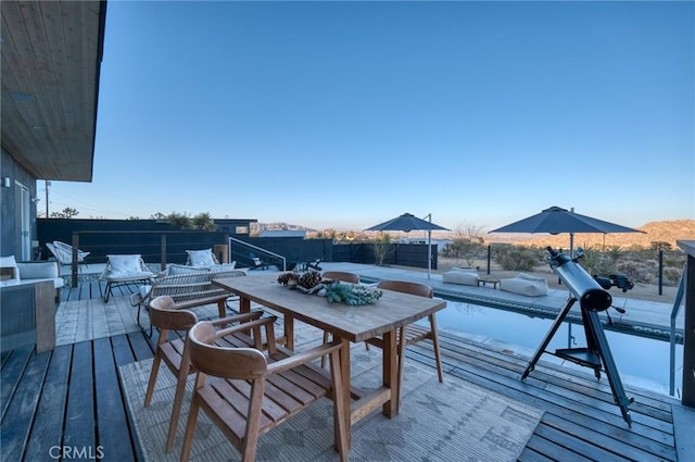 wooden deck with outdoor lounge area