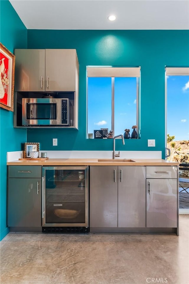 kitchen featuring sink and wine cooler