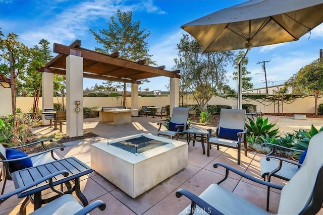 view of patio / terrace with a pergola and an outdoor fire pit