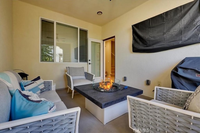 view of patio / terrace featuring an outdoor living space with a fire pit