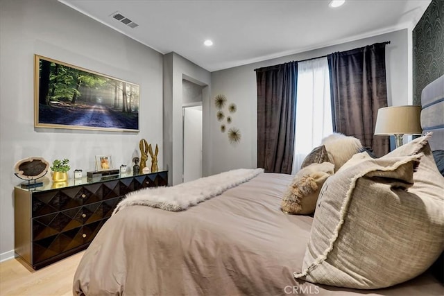 bedroom with light hardwood / wood-style floors