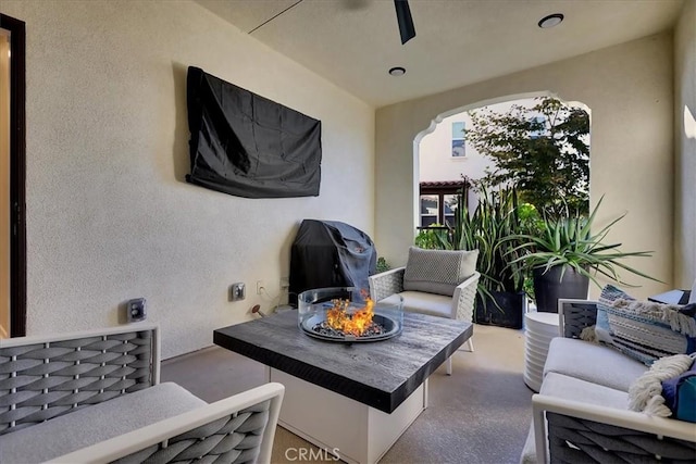 view of patio / terrace featuring grilling area and an outdoor living space with a fire pit