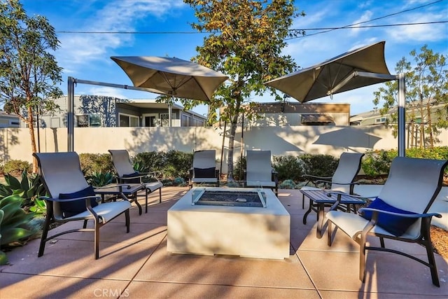 view of patio featuring an outdoor fire pit