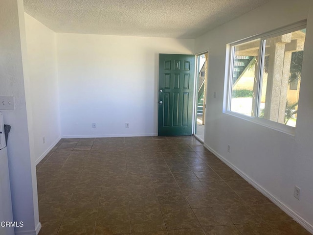 entrance foyer with a textured ceiling