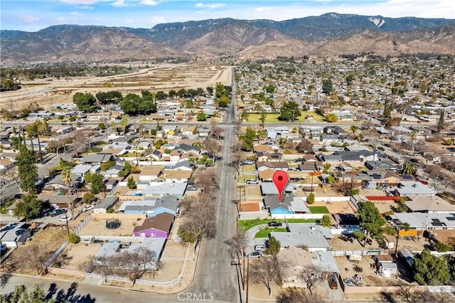 birds eye view of property with a mountain view