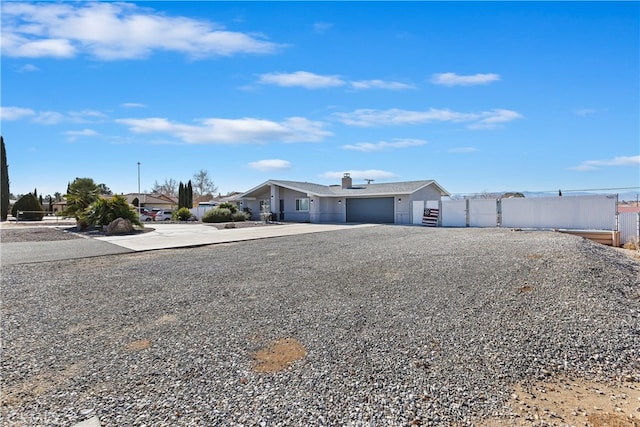 single story home featuring a garage