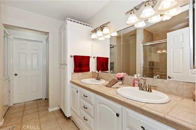 bathroom featuring vanity, walk in shower, and tile patterned floors