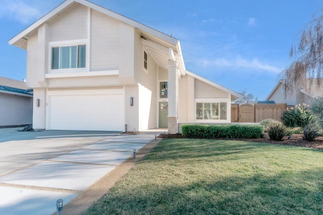 view of front of property with a garage and a front lawn