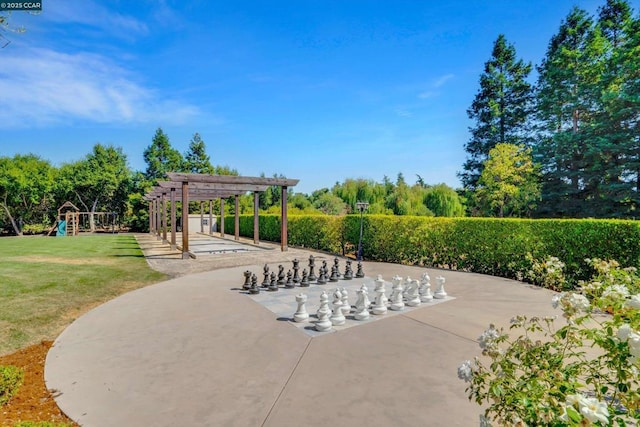 view of property's community featuring a playground, a yard, and a pergola