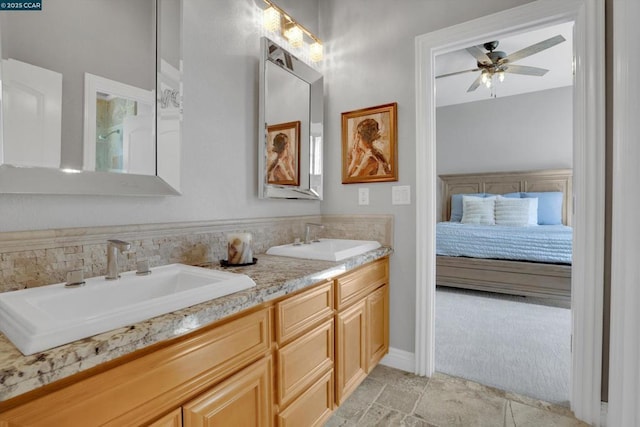 bathroom featuring vanity and ceiling fan