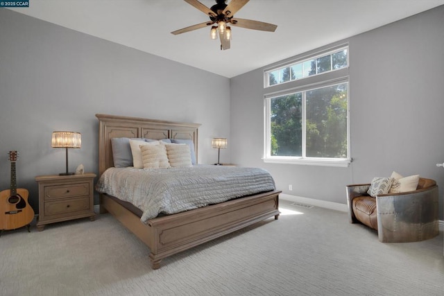 bedroom featuring ceiling fan and light colored carpet