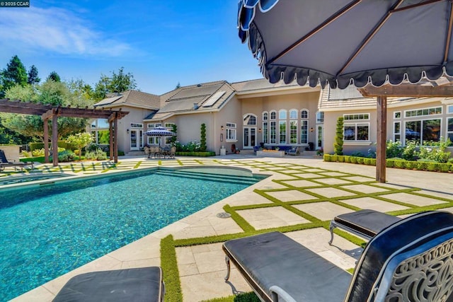 view of swimming pool featuring a pergola and a patio area