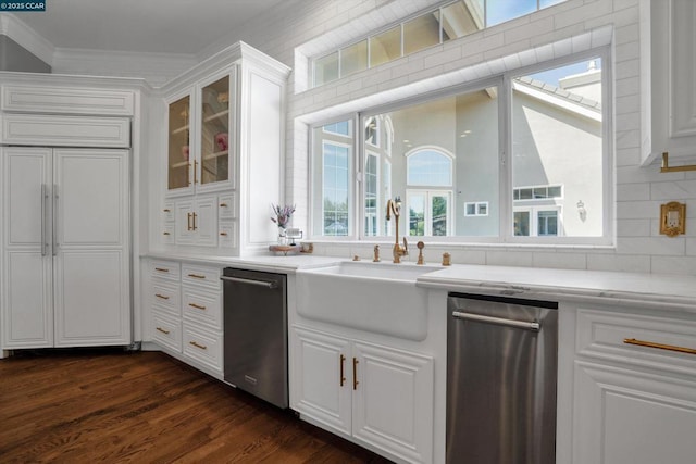 kitchen featuring sink, white cabinets, dishwasher, and a wealth of natural light