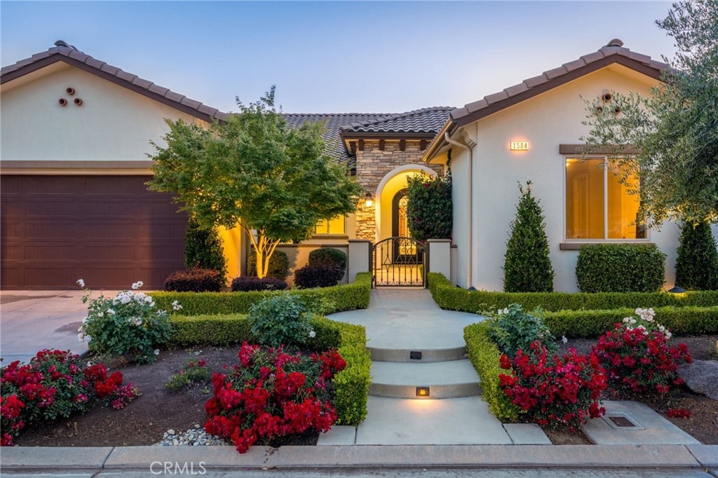 mediterranean / spanish-style home featuring a garage