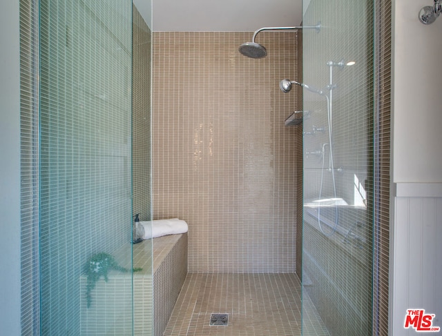 bathroom with a tile shower