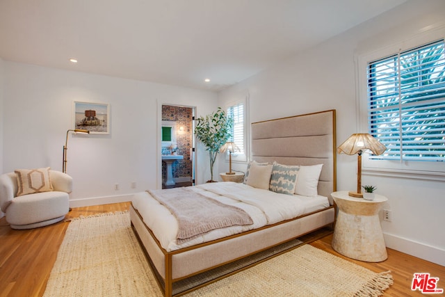 bedroom featuring hardwood / wood-style floors