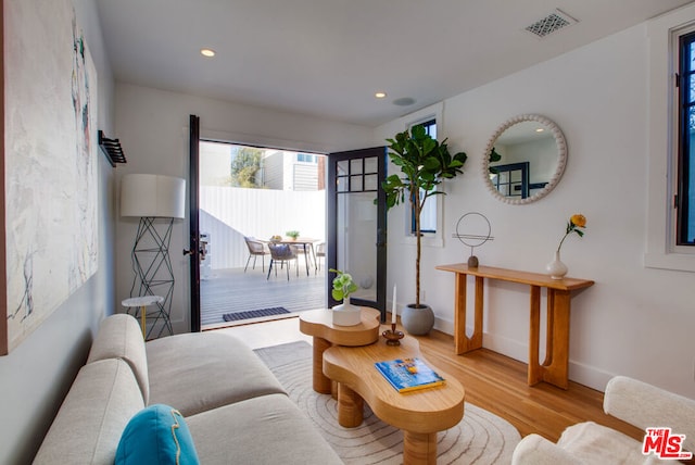 sitting room featuring light hardwood / wood-style floors