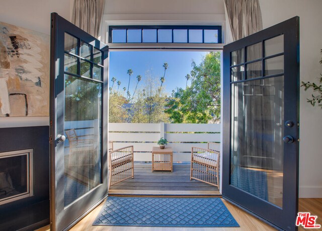 doorway to outside featuring hardwood / wood-style flooring