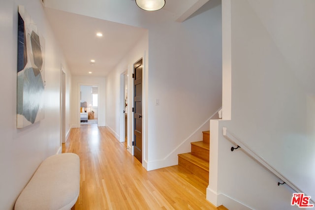 hall with light wood-type flooring