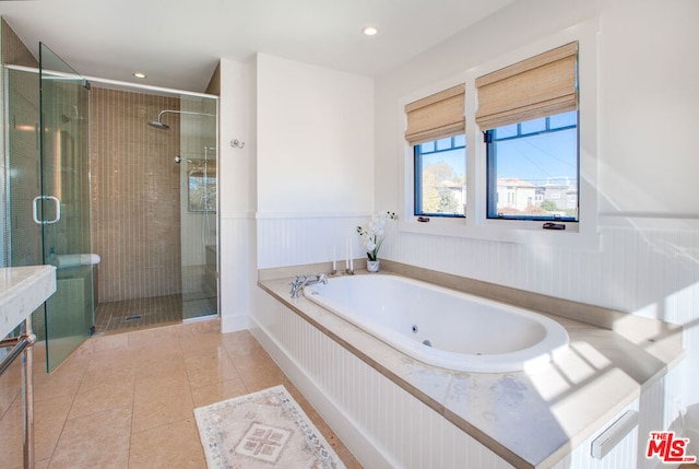 bathroom featuring separate shower and tub and tile patterned flooring