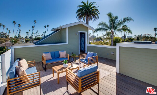 deck featuring an outdoor living space