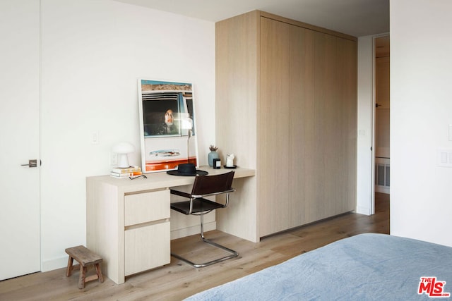 bedroom with light hardwood / wood-style floors