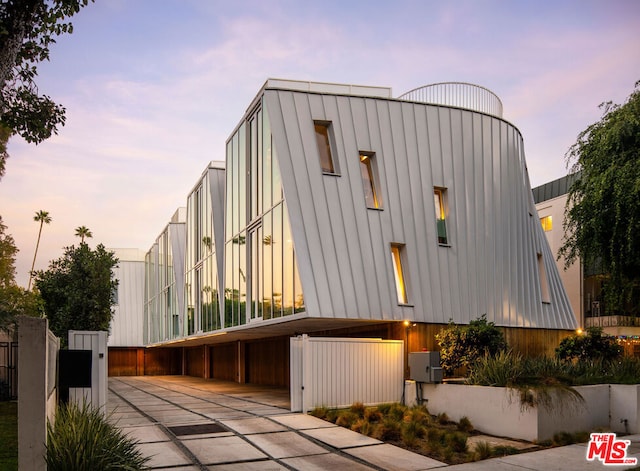 outdoor building at dusk with a garage