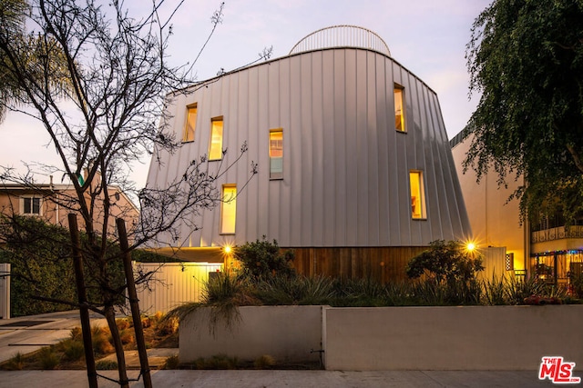 view of property exterior at dusk