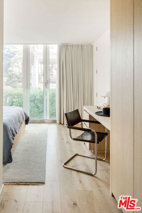 bedroom with light hardwood / wood-style floors