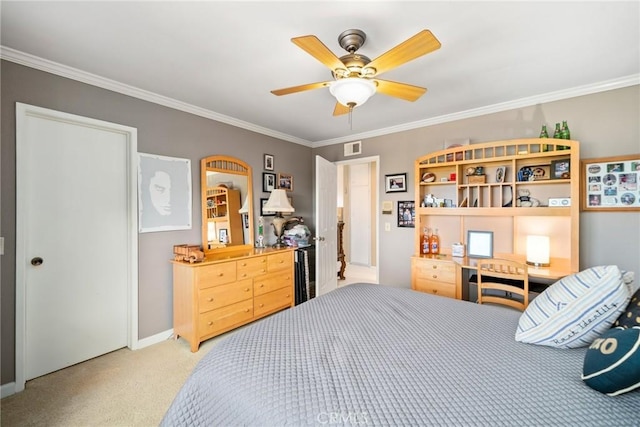 bedroom with ceiling fan, ornamental molding, and carpet floors