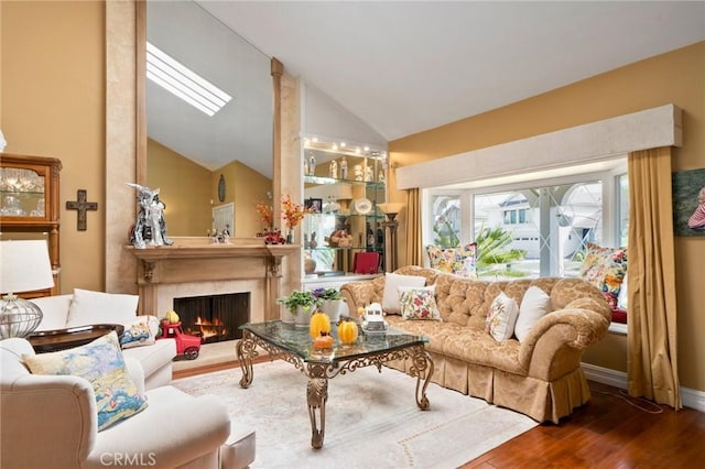 living room with a fireplace, lofted ceiling, and dark hardwood / wood-style floors