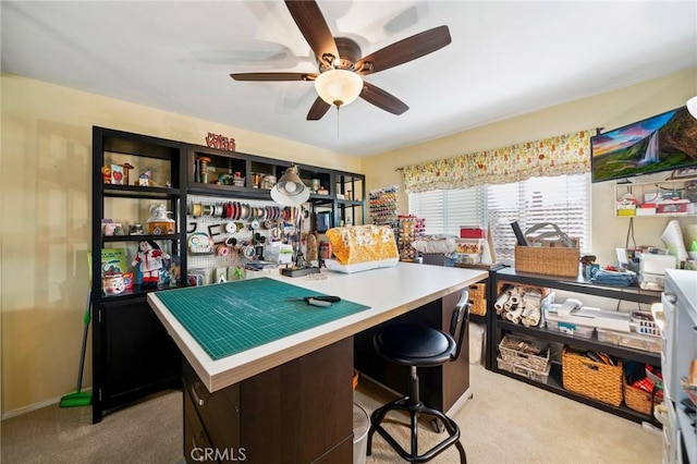 office area featuring ceiling fan and light colored carpet