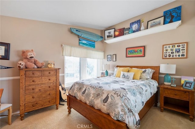 bedroom featuring light carpet