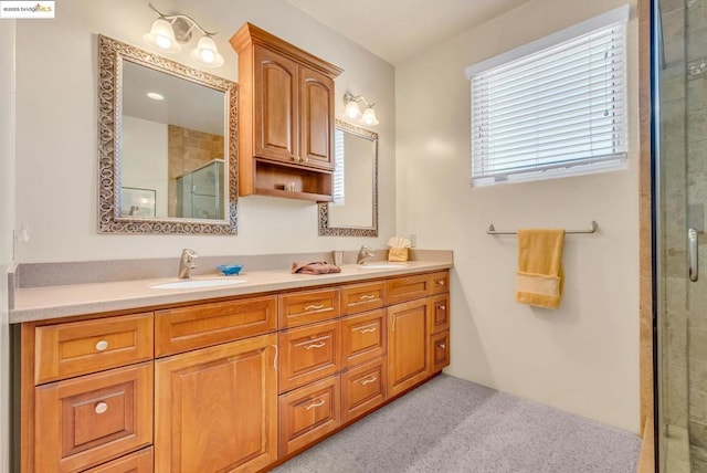 bathroom featuring an enclosed shower and vanity