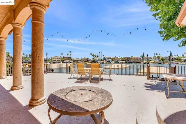 view of patio / terrace with a water view