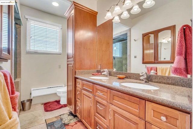 bathroom with a baseboard radiator, a shower with door, tile patterned floors, toilet, and vanity