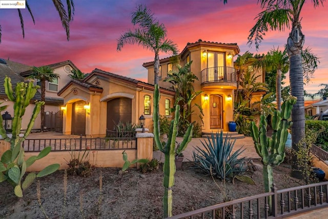 mediterranean / spanish-style home featuring a balcony