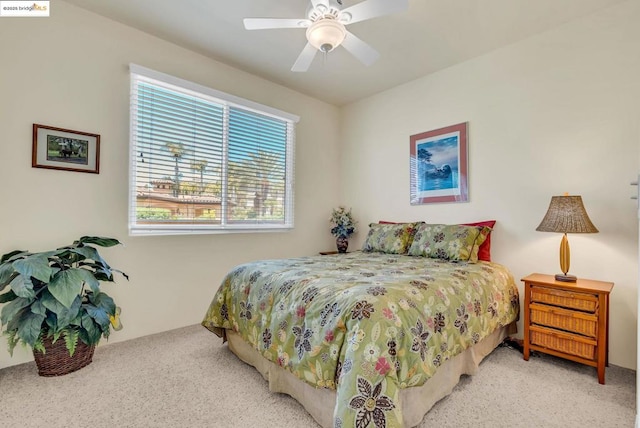 bedroom with ceiling fan and light colored carpet