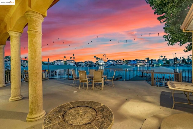 patio terrace at dusk with a water view