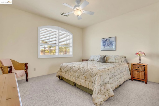 bedroom with ceiling fan and carpet flooring