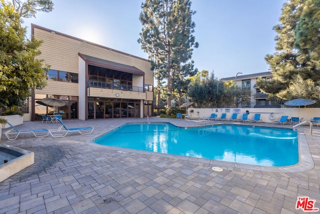 view of pool with a patio area