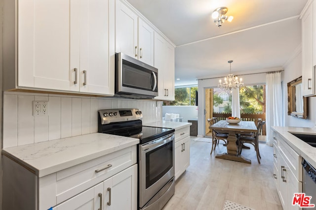 kitchen featuring white cabinets and stainless steel appliances